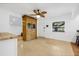 Bright dining room with tile flooring, front door, and a wooden hutch for storage at 3310 W Ballast Point Blvd, Tampa, FL 33611