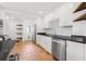 Stylish kitchen featuring stainless appliances, tile backsplash, and convenient access to storage at 3310 W Ballast Point Blvd, Tampa, FL 33611
