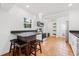 Bright kitchen featuring stainless steel appliances, breakfast bar with seating, and modern finishes at 3310 W Ballast Point Blvd, Tampa, FL 33611