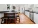 Kitchen boasts stainless appliances, breakfast bar with seating, and sleek black countertops at 3310 W Ballast Point Blvd, Tampa, FL 33611