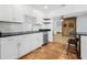 Modern kitchen featuring stainless steel appliances, tile backsplash, and open layout design at 3310 W Ballast Point Blvd, Tampa, FL 33611