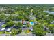 Aerial view of community featuring swimming pool, parking, and ample green spaces at 3447 Killdeer Pl, Palm Harbor, FL 34685