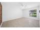 Bright bedroom with wood-look flooring and a ceiling fan at 3447 Killdeer Pl, Palm Harbor, FL 34685