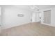 Clean bedroom featuring wood-look flooring and an ensuite bathroom at 3447 Killdeer Pl, Palm Harbor, FL 34685