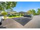 Carport features easy access and ample parking in a well-maintained community at 3447 Killdeer Pl, Palm Harbor, FL 34685