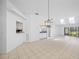Bright living room featuring skylights and tile flooring at 3447 Killdeer Pl, Palm Harbor, FL 34685