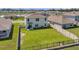 Aerial view of a home and backyard surrounded by fences and other homes in the neighborhood at 3739 Capri Coast Dr, Plant City, FL 33565