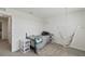 Cozy bedroom features neutral color palette, twin bed and unique hammock chair at 3739 Capri Coast Dr, Plant City, FL 33565