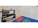 Bedroom features a neutral carpet, a twin bed with Florida Gators themed bedding, and a black desk at 3739 Capri Coast Dr, Plant City, FL 33565