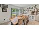 Cozy dining area featuring a large wooden table, decorative chairs and a view of the backyard at 3739 Capri Coast Dr, Plant City, FL 33565