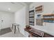Bright foyer with decorative wall art, a modern table, and an elegant black and white patterned rug at 3739 Capri Coast Dr, Plant City, FL 33565