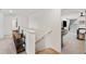 Upstairs hallway featuring carpet flooring leading to bedrooms at 3739 Capri Coast Dr, Plant City, FL 33565