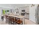 Bright kitchen boasts granite countertops, a large island with seating, and stainless steel appliances at 3739 Capri Coast Dr, Plant City, FL 33565