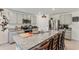 Bright kitchen boasts granite countertops, a large island with seating, and stainless steel appliances at 3739 Capri Coast Dr, Plant City, FL 33565