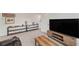 Second living area featuring shelving unit and media center at 3739 Capri Coast Dr, Plant City, FL 33565