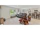 Bright living room features large windows, tile flooring, and open concept design at 3739 Capri Coast Dr, Plant City, FL 33565