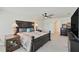 Spacious main bedroom with ceiling fan, neutral colors, and dark wood accents at 3739 Capri Coast Dr, Plant City, FL 33565