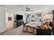 Large main bedroom features ceiling fan and an en suite bathroom at 3739 Capri Coast Dr, Plant City, FL 33565