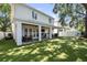 Spacious backyard with covered patio, dining area, and outdoor seating at 3809 W San Pedro St, Tampa, FL 33629