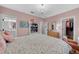 Bright bedroom featuring a chandelier, a closet, and access to a bathroom with a vanity and mirror at 3809 W San Pedro St, Tampa, FL 33629