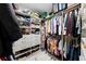 Walk-in closet showcasing custom shelving, hanging racks, and storage solutions for optimal organization at 3809 W San Pedro St, Tampa, FL 33629