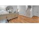 Welcoming entryway with hardwood floors, a console table with decor, and a staircase leading to the upper level at 3809 W San Pedro St, Tampa, FL 33629