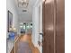 Elegant entryway featuring hardwood floors, a decorative rug, and a view into the open living space at 3809 W San Pedro St, Tampa, FL 33629