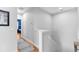 Bright hallway with hardwood flooring that offers views into adjacent bedrooms at 3809 W San Pedro St, Tampa, FL 33629
