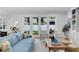 Elegant living room with plenty of natural light, comfortable seating, and a seamless flow to the outdoors at 3809 W San Pedro St, Tampa, FL 33629