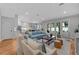 Spacious living area with an open layout, hardwood floors, and easy access to the kitchen and outdoor spaces at 3809 W San Pedro St, Tampa, FL 33629
