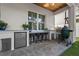 Outdoor kitchen under a covered patio with a built-in BBQ, sink and mini-fridge at 3809 W San Pedro St, Tampa, FL 33629