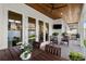 Covered patio featuring a dining area, ceiling fan, and outdoor kitchen at 3809 W San Pedro St, Tampa, FL 33629