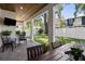 Covered outdoor patio with dining area and sitting area, perfect for entertaining at 3809 W San Pedro St, Tampa, FL 33629