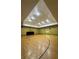 Full-sized indoor basketball court with polished wooden floors, hoops, and ample lighting for recreational sports at 4207 S Dale Mabry Hwy # 9106, Tampa, FL 33611