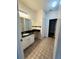 Bathroom featuring granite counters, tile floors and a shower-tub combo with ample space at 4207 S Dale Mabry Hwy # 9106, Tampa, FL 33611