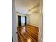 Bright bedroom with a ceiling fan, hardwood flooring and a large window with dark curtains at 4207 S Dale Mabry Hwy # 9106, Tampa, FL 33611