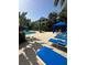 Picturesque poolside view with sun loungers, shaded cabanas, and lush greenery, creating a perfect outdoor oasis at 4207 S Dale Mabry Hwy # 9106, Tampa, FL 33611