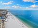 An aerial view of the beach and the pier showing ocean activities on a bright sunny day at 479 E Shore Dr # 5, Clearwater, FL 33767