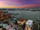 Expansive aerial view of waterfront homes and a marina at sunset, a boater's paradise at 479 E Shore Dr # 5, Clearwater, FL 33767