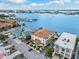A high angle view of a waterfront property featuring lush lawns and convenient street parking at 479 E Shore Dr # 5, Clearwater, FL 33767