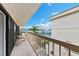 Balcony features a view of the pool and a marina filled with boats and overlooking a blue horizon at 479 E Shore Dr # 5, Clearwater, FL 33767