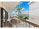 Serene balcony setting with relaxing seating, palm trees, and views of the marina at 479 E Shore Dr # 5, Clearwater, FL 33767