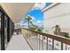 Balcony with a view of the marina, palm trees, and outdoor seating at 479 E Shore Dr # 5, Clearwater, FL 33767