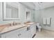 Bathroom with dual sinks, mirrors and updated fixtures with a toilet at 479 E Shore Dr # 5, Clearwater, FL 33767