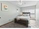 Bedroom boasts a cozy queen bed and walkout to a private balcony overlooking the community at 479 E Shore Dr # 5, Clearwater, FL 33767