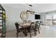 Inviting dining room features a large decorative clock, stylish furnishings, and bright natural lighting at 479 E Shore Dr # 5, Clearwater, FL 33767