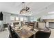 Coastal dining room with wood table, decorative oars, and a sliding glass door to the outside balcony at 479 E Shore Dr # 5, Clearwater, FL 33767