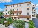 Well-maintained condo building featuring charming architecture and lush landscaping at 479 E Shore Dr # 5, Clearwater, FL 33767