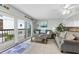 Bright living room with sliding glass doors leading to a balcony at 479 E Shore Dr # 5, Clearwater, FL 33767
