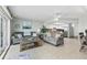 Open-concept living room, dining, and kitchen area with tile flooring at 479 E Shore Dr # 5, Clearwater, FL 33767